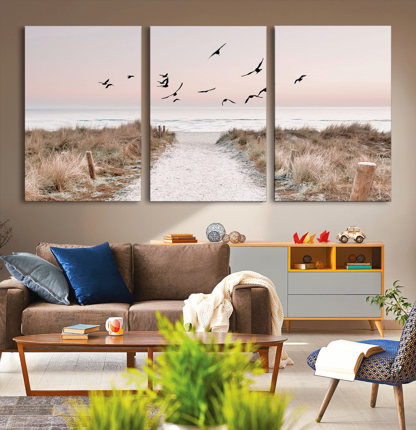 A peaceful coastal pathway leading to the ocean, with birds flying across a soft pastel sky, creating a calm and scenic beach atmosphere.