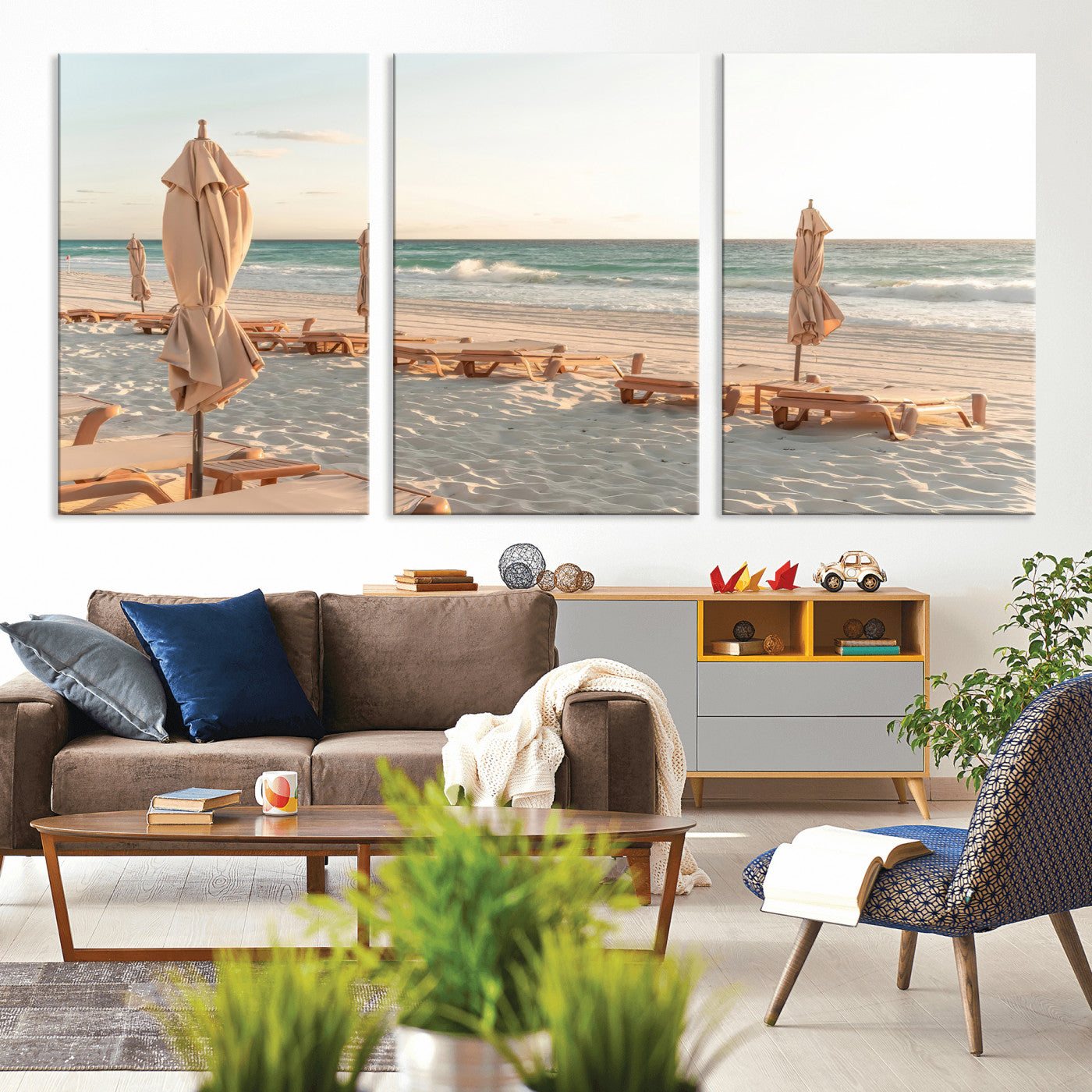 Minimalist photo of empty beach loungers and umbrellas on soft sand, ideal for calm seaside or pastel coastal-style home decor.
