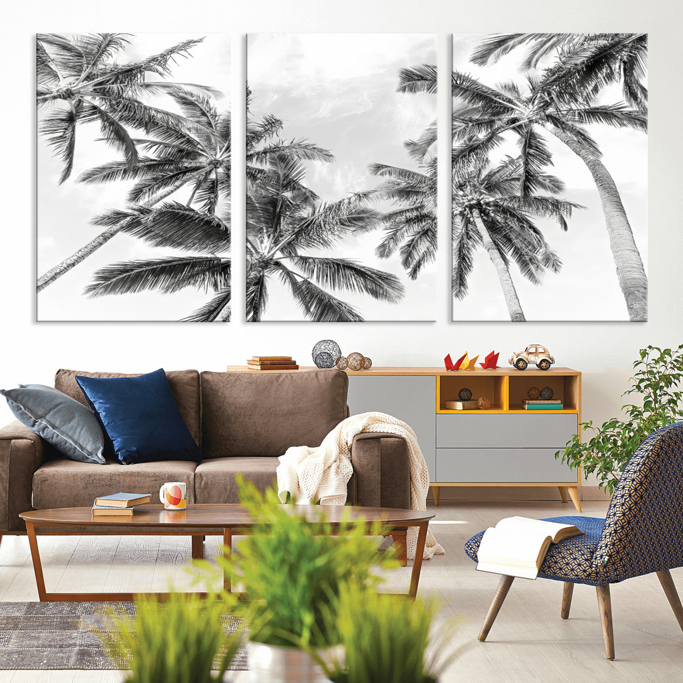 Black and white tropical palm trees viewed from below, swaying gently against a bright sky, creating a serene and elegant coastal atmosphere.