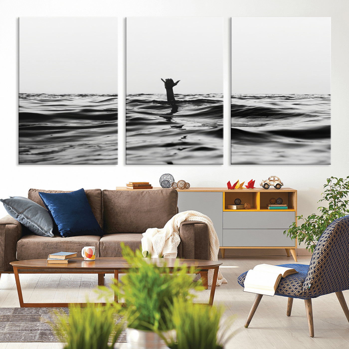 Black and white ocean with a hand making a surfer sign among dark waves, creating a dramatic and minimalist seascape with bold contrast.