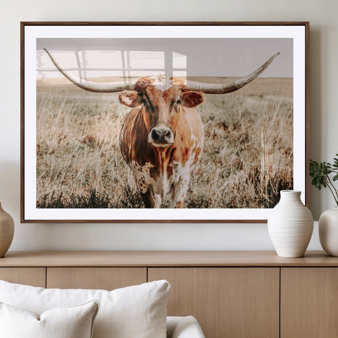 Framed longhorn cow canvas wall art with rustic prairie background, western animal print perfect for farmhouse or ranch style decor