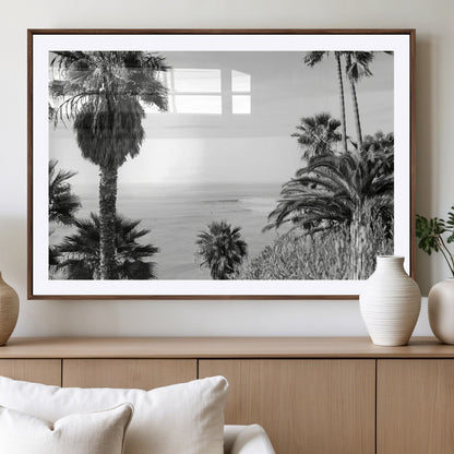 Monochrome canvas of palm trees framing a coastal surf scene, perfect for California-inspired or retro black-and-white beach decor.
