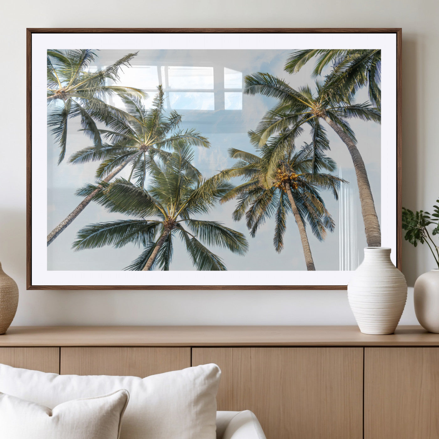 Framed canvas of tall palm trees reaching into a tropical sky, ideal for beach home or relaxed island-inspired wall decor.