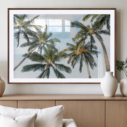 Framed canvas of tall palm trees reaching into a tropical sky, ideal for beach home or relaxed island-inspired wall decor.