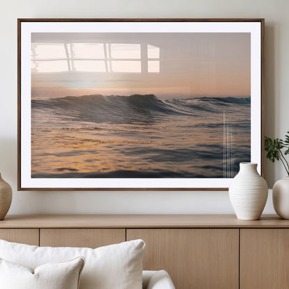 Framed canvas of ocean waves glowing in sunset light, ideal for golden hour calm or peaceful coastal-inspired wall decor.