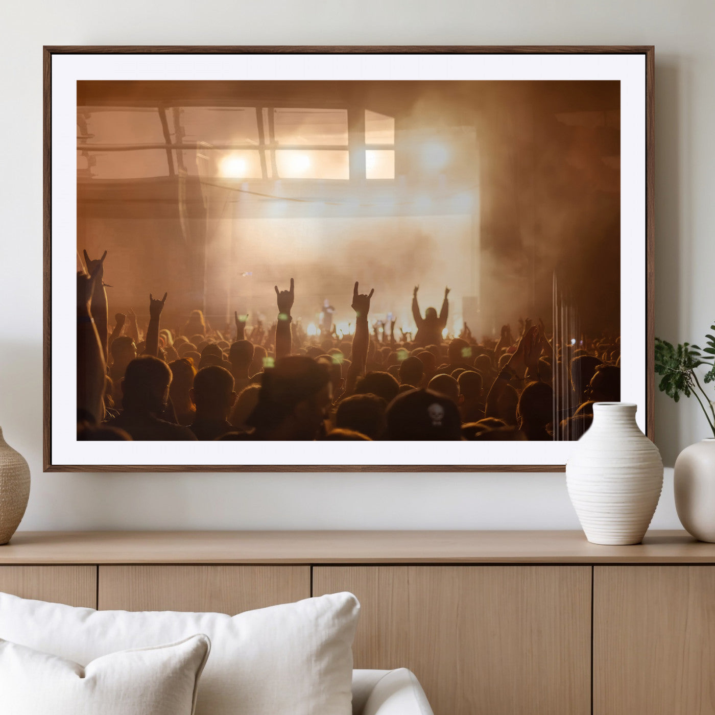 High-energy photo of a rock concert crowd with raised hands and smoky lights, perfect for industrial or music-themed room decor.