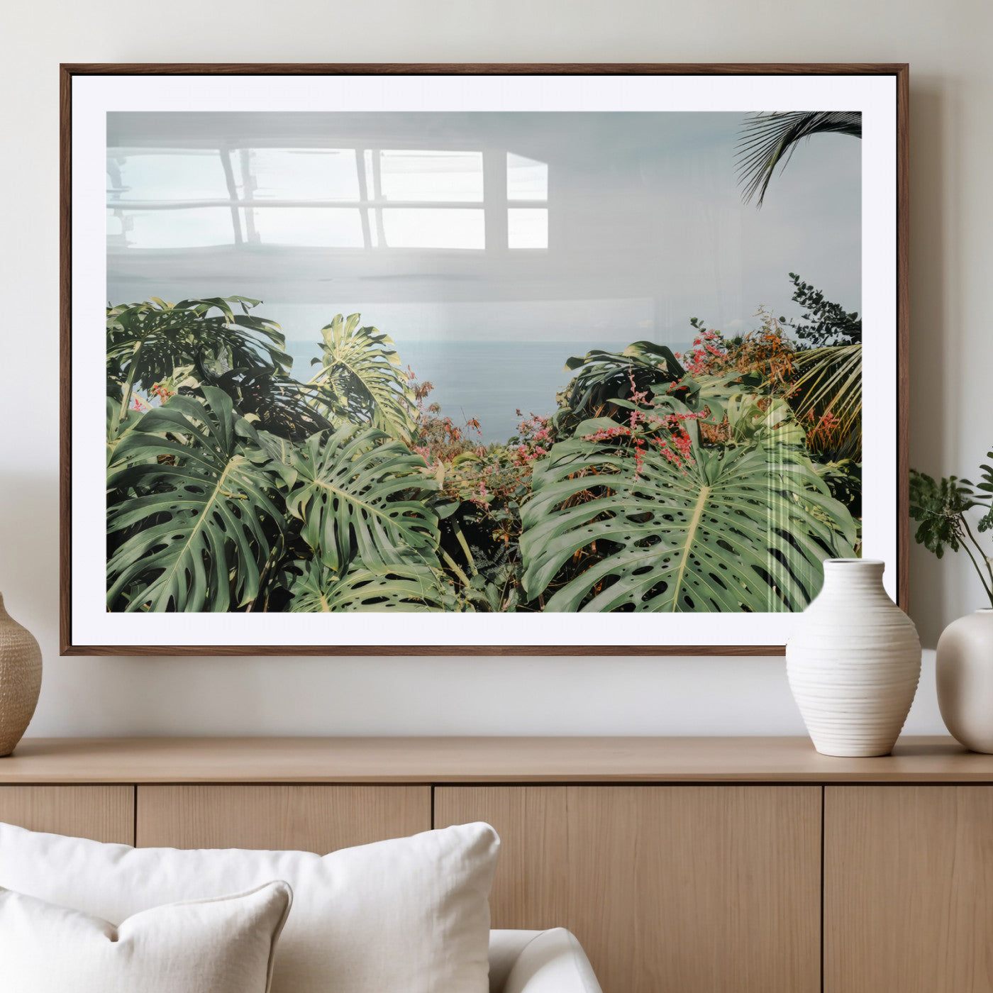 Monstera leaves and tropical flowers framing a calm ocean view, ideal for tropical coastal or exotic jungle-style interior wall decor.