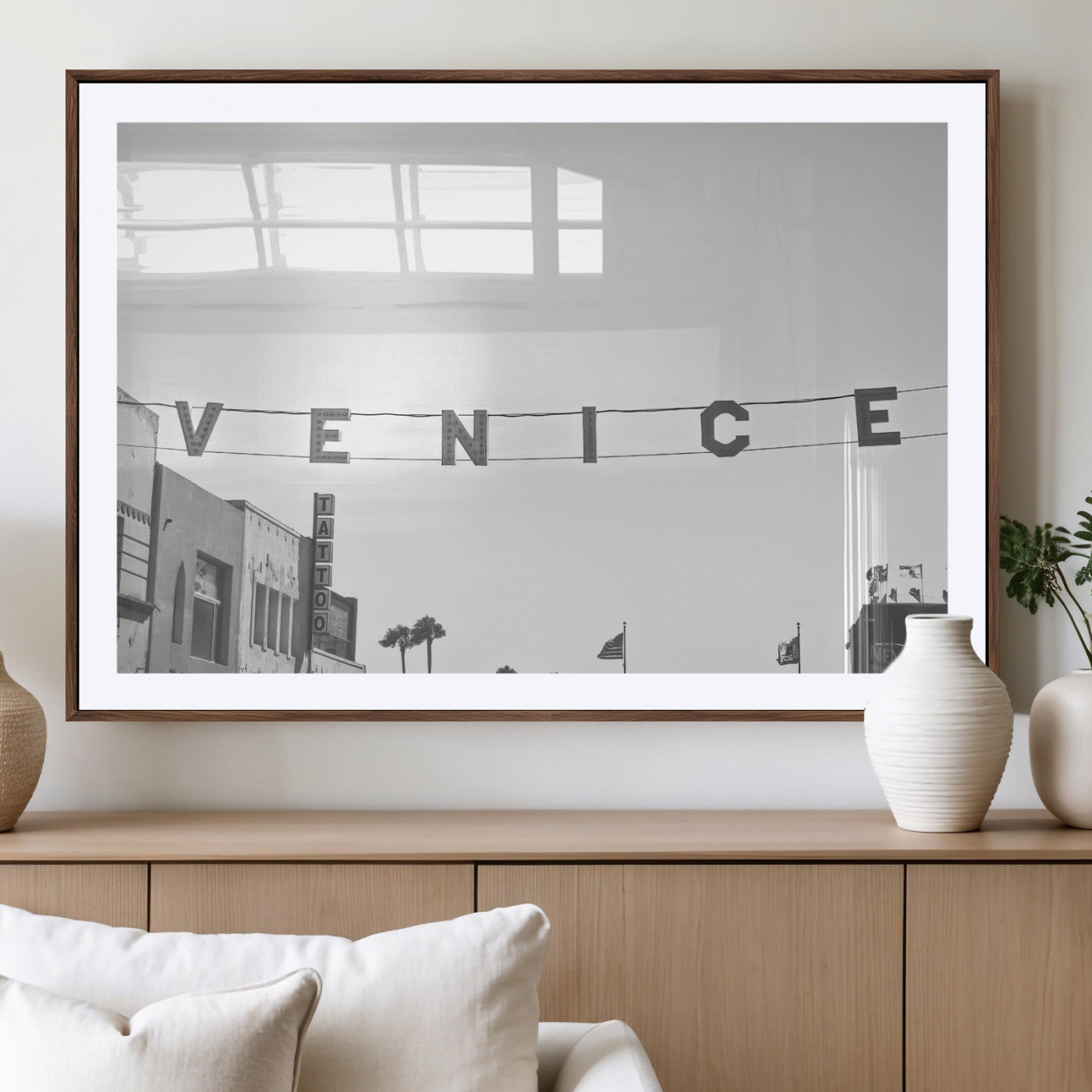 Black and white photo of Venice Beach sign and palm-lined street, perfect for urban coastal or minimalist LA-inspired wall decoration.