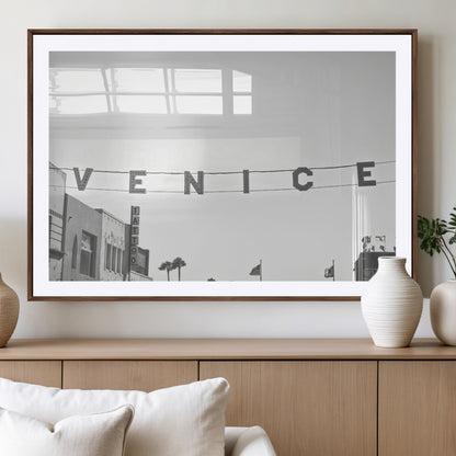Black and white photo of Venice Beach sign and palm-lined street, perfect for urban coastal or minimalist LA-inspired wall decoration.