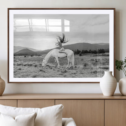 Black and white photo of a woman on a white horse in moody tones, ideal for Western Boho or modern rustic-style home decor.