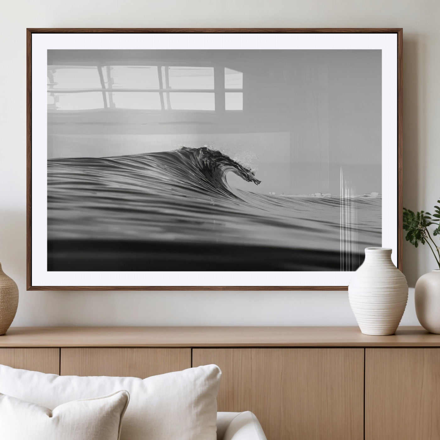 Striking black and white photo of a curling wave, ideal for modern coastal or minimalist wall decor settings.