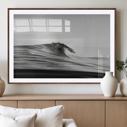 Striking black and white photo of a curling wave, ideal for modern coastal or minimalist wall decor settings.