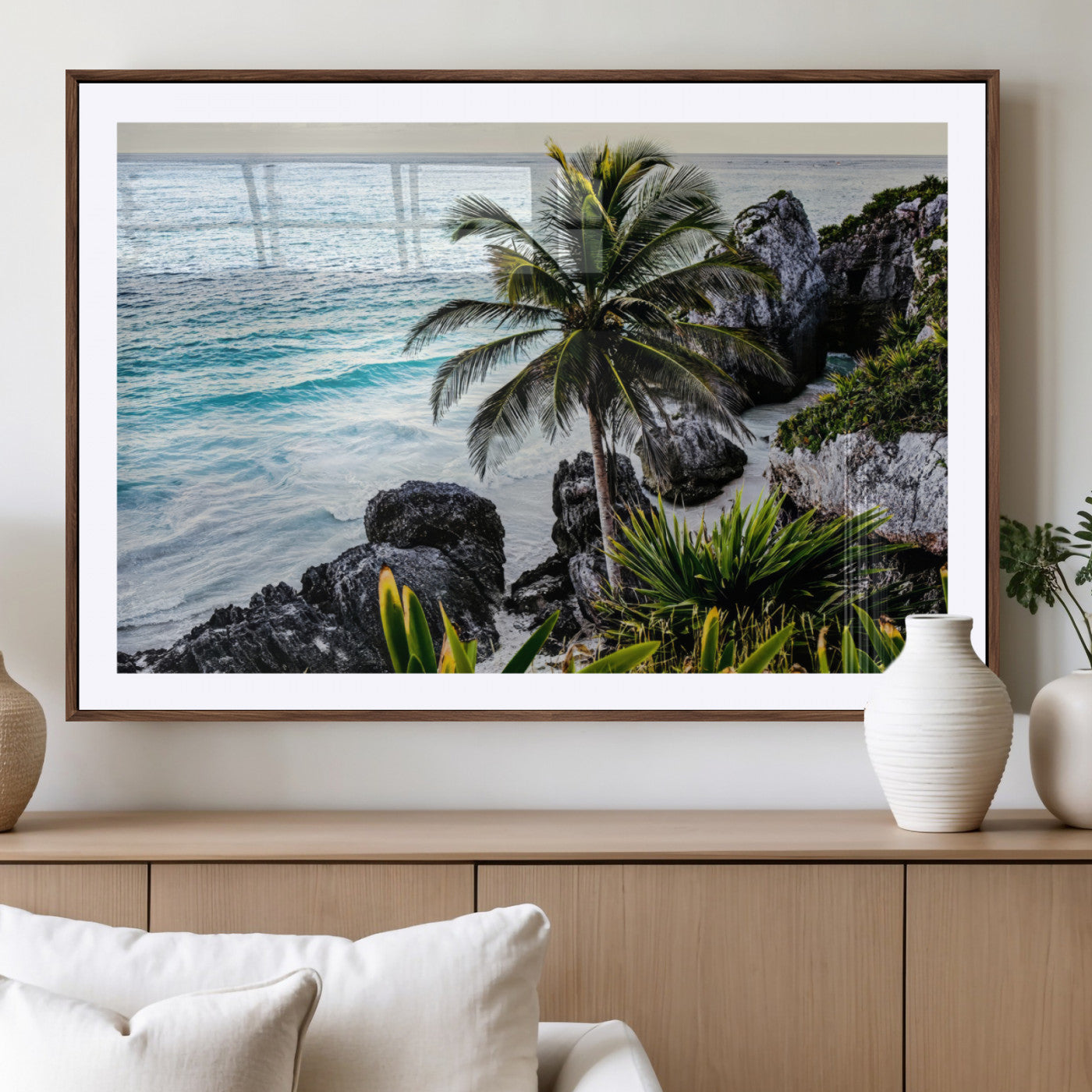 Framed canvas of a vibrant tropical coastline with palm trees, rocky cliffs, and turquoise waters, ideal for tropical coastal home decor.