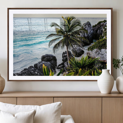 Framed canvas of a vibrant tropical coastline with palm trees, rocky cliffs, and turquoise waters, ideal for tropical coastal home decor.