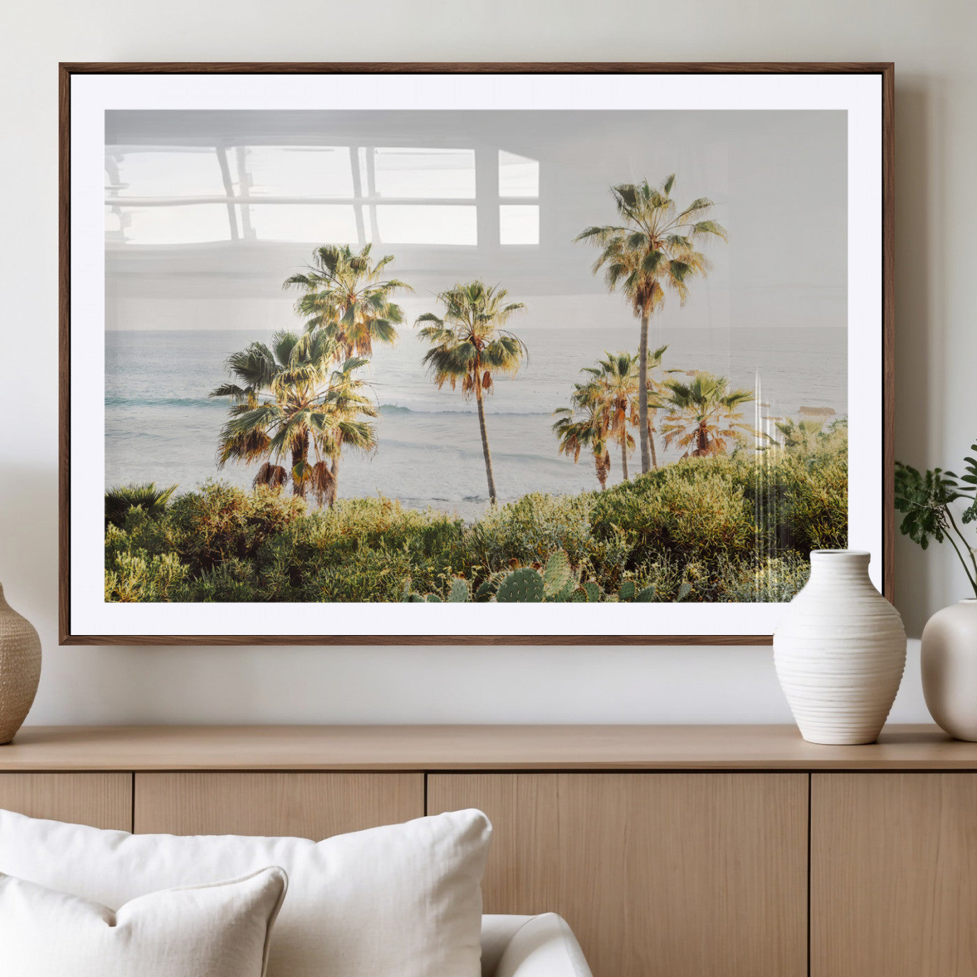Framed print of sunlit palm trees on the California coast with warm tones, perfect for coastal minimalist or beach-style home decor.