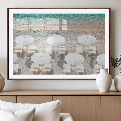 A bright beach scene with white umbrellas, pastel sand, and turquoise waters, creating a tranquil coastal vibe, perfect for beach house or summer decor.