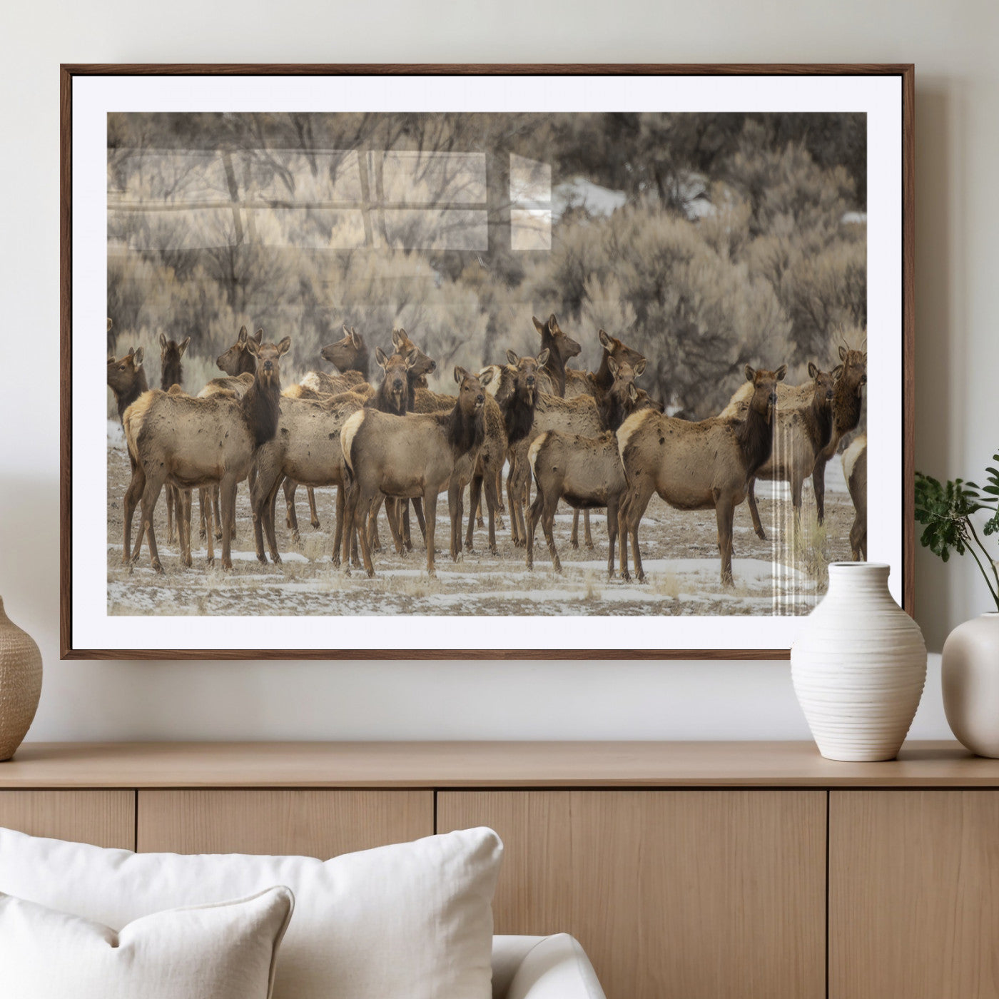 A large herd of elk standing in an open field with soft earthy tones, ideal for rustic lodge or western-themed home wall decor.