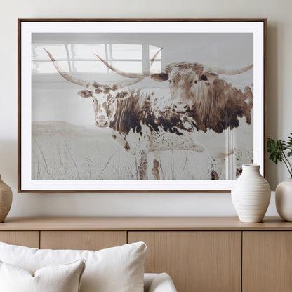 Two longhorn cows standing in a sepia-toned pasture with soft light, ideal for rustic or farmhouse-themed neutral wall decor.