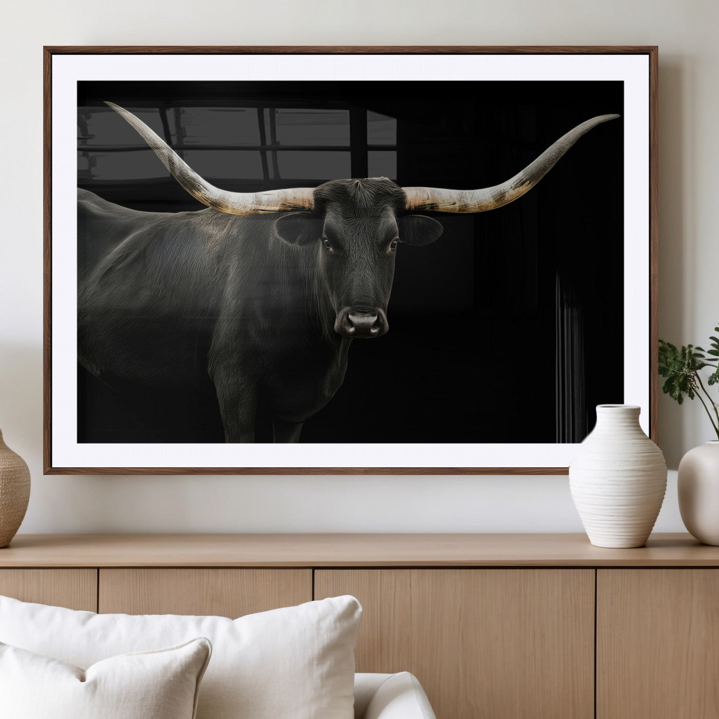 Close-up of a black Texas longhorn with large curved horns on black background, ideal for rustic farmhouse or modern western interiors.