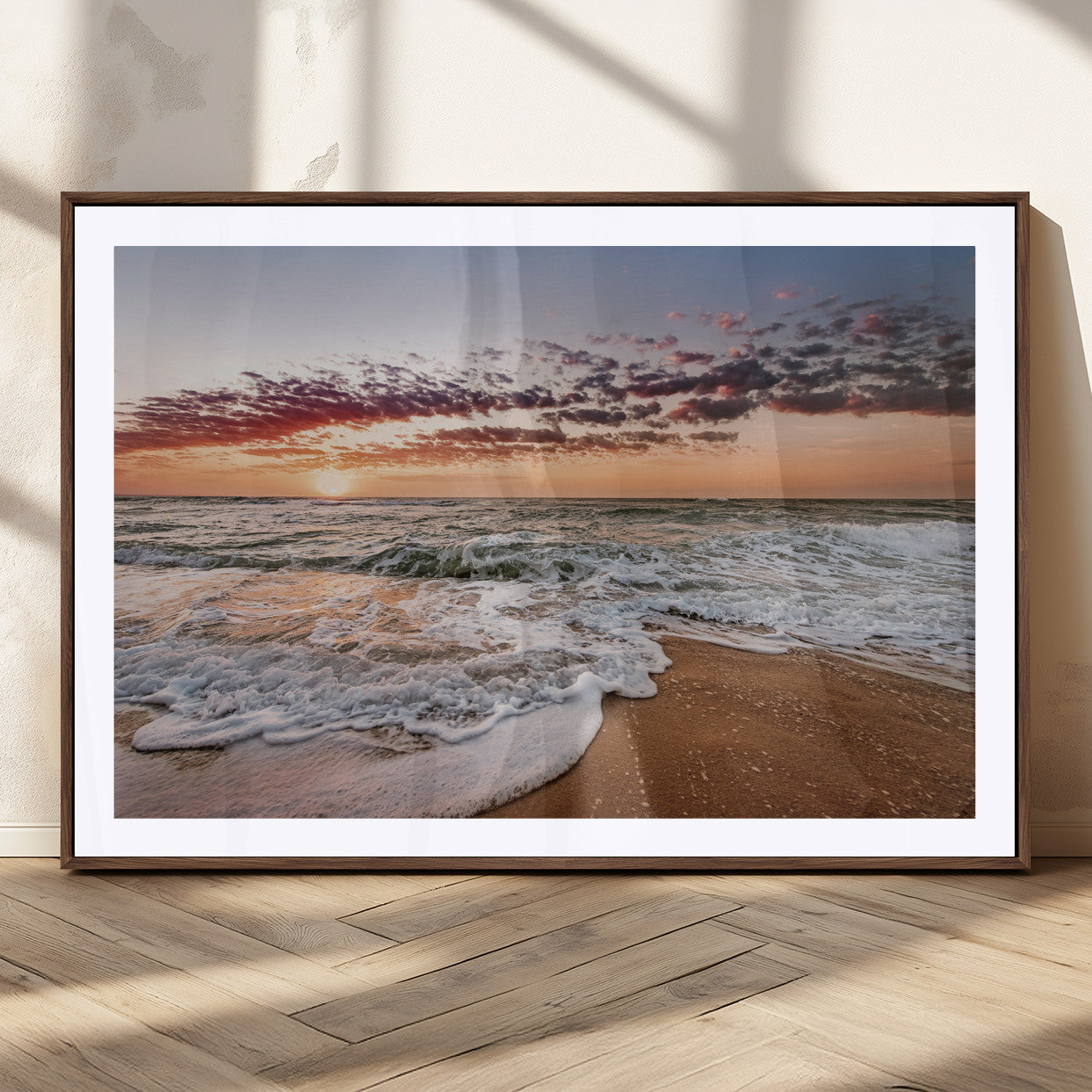 Canvas of a sunset over a foamy ocean shore with warm light and gentle waves, ideal for coastal or beach-themed home decor.