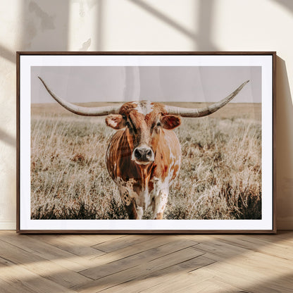 Framed longhorn cow canvas wall art with rustic prairie background, western animal print perfect for farmhouse or ranch style decor