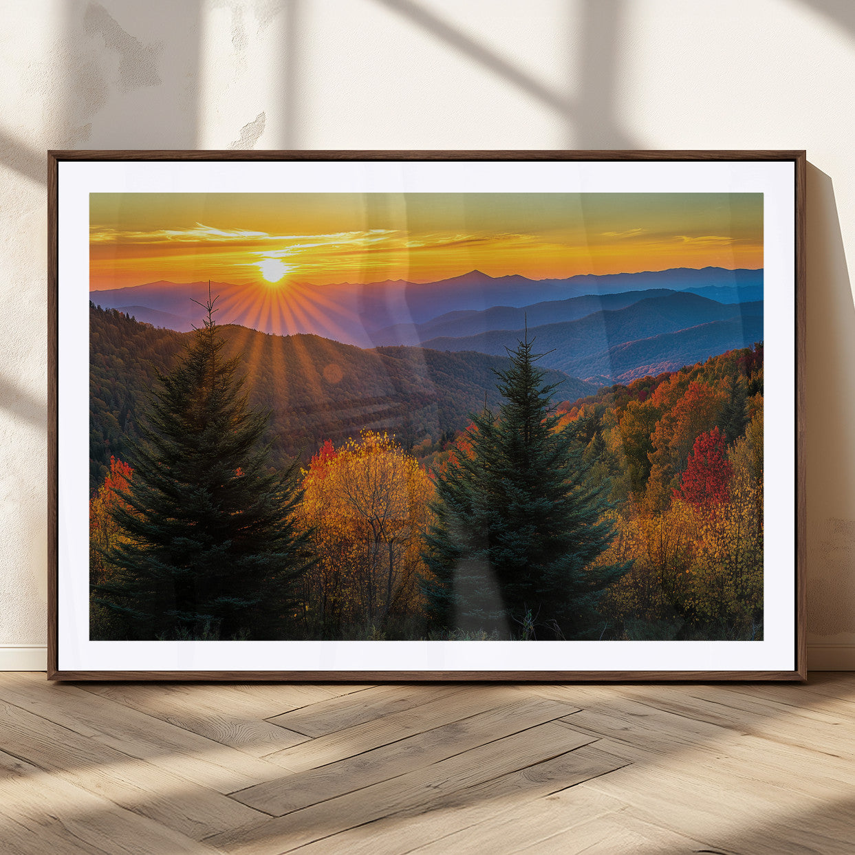 Vibrant sunset over autumn mountains with colorful trees and warm light, ideal for nature lovers or cabin-style wall decor.