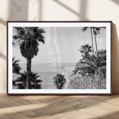 Monochrome canvas of palm trees framing a coastal surf scene, perfect for California-inspired or retro black-and-white beach decor.