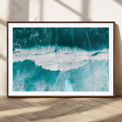 Aerial view of turquoise ocean waves crashing with white foam, perfect for tropical coastal or modern beach-style home decor.