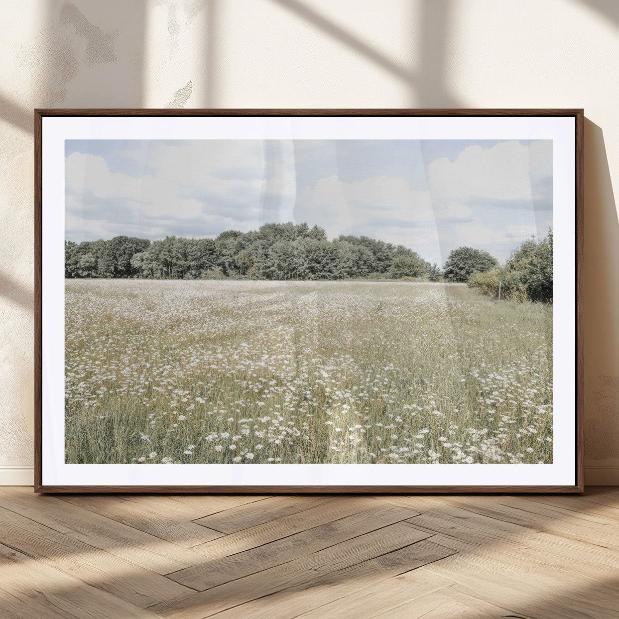 Soft-toned image of a wild daisy field under a cloudy sky, ideal for neutral or Scandinavian-inspired home decor.