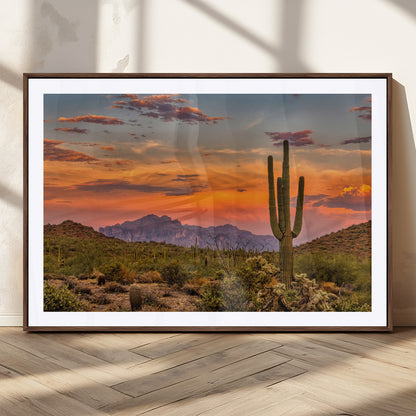 Vibrant desert sunset with saguaro cacti and distant mountains, perfect for Southwestern or warm-toned home decor.