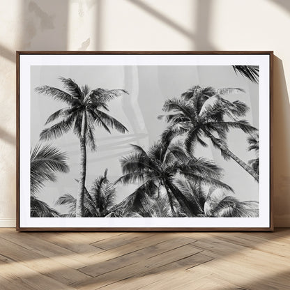 Black and white canvas of tall palm trees in moody tones, perfect for modern tropical minimalist or coastal-style home decor.