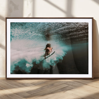 Vibrant underwater photo of a female surfer diving through turquoise waves, perfect for coastal boho or surf-inspired home decor.