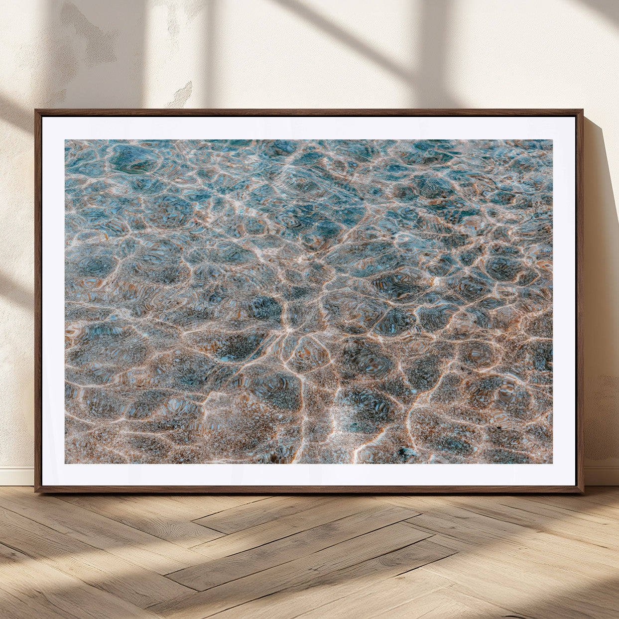 Close-up of sunlit ocean ripples with aqua blue and golden tones, ideal for modern coastal or minimalist home decor.
