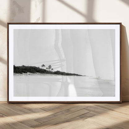 A black and white minimalist coastal scene with a vast open beach, distant palm trees, and a lone figure walking along the shoreline, evoking serenity and solitude.