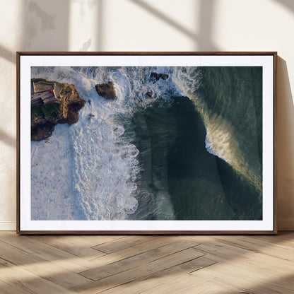 Canvas showing an aerial view of crashing waves along the Nazaré coastline, perfect for dramatic coastal or ocean-themed home decor.
