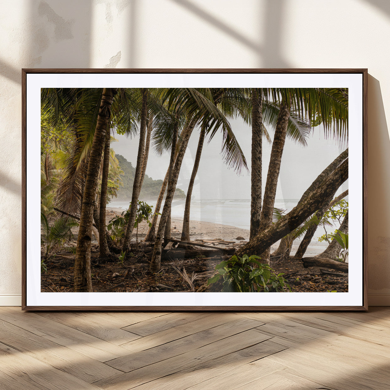 Dense tropical palm trees framing a sandy beach and ocean shore, ideal for jungle or coastal themed interior wall decor.