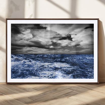 Moody canvas wall art of a stormy ocean under a dramatic black-and-white sky, perfect for bold or coastal-style interiors.