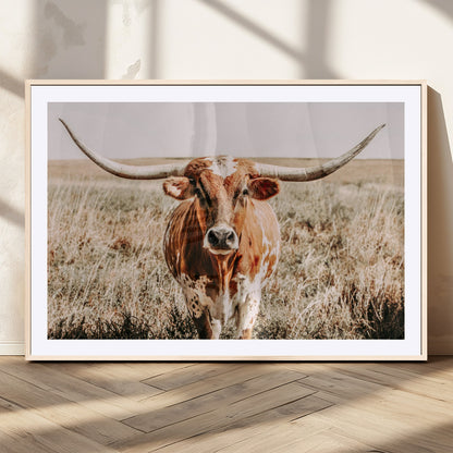 Framed longhorn cow canvas wall art with rustic prairie background, western animal print perfect for farmhouse or ranch style decor