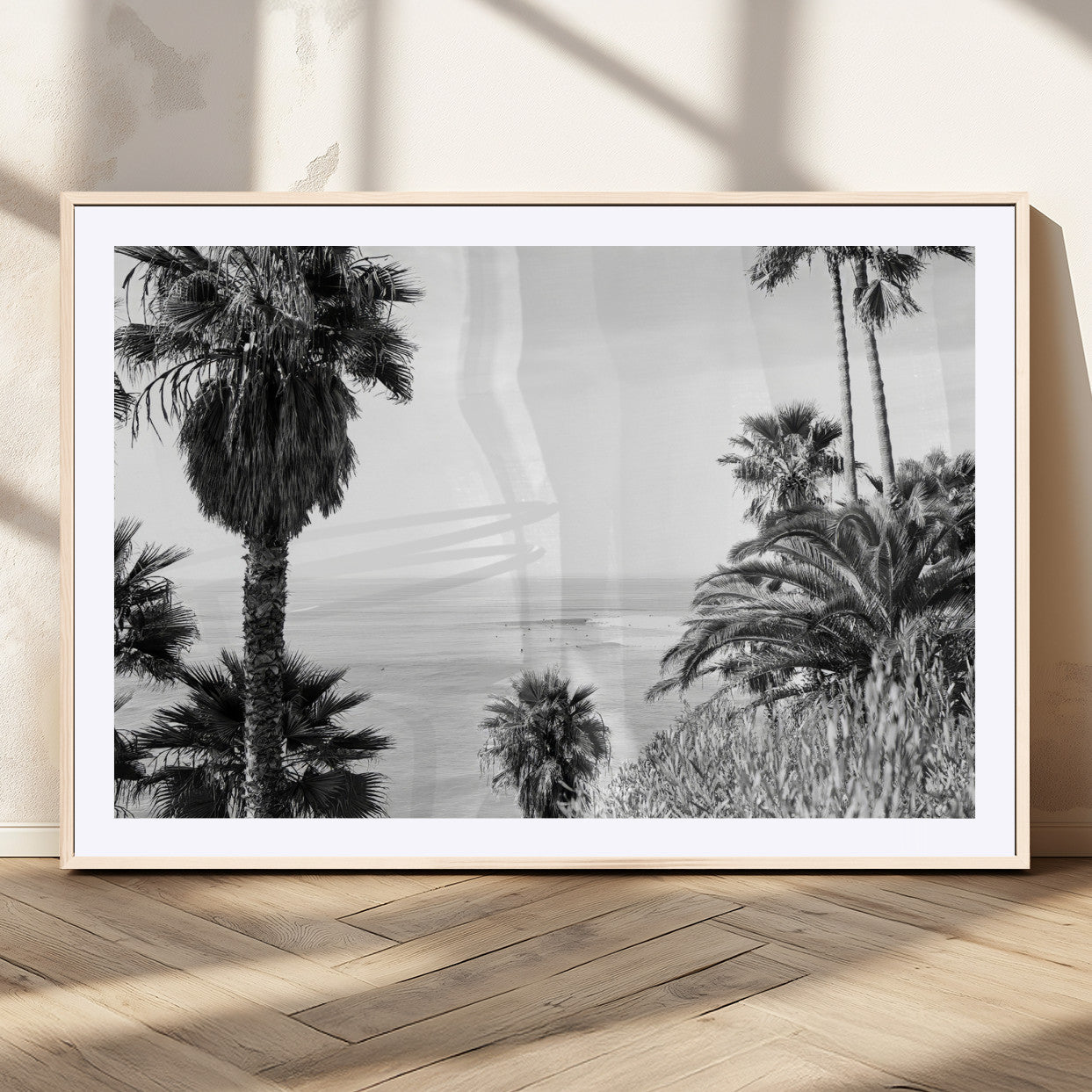 Monochrome canvas of palm trees framing a coastal surf scene, perfect for California-inspired or retro black-and-white beach decor.