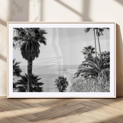 Monochrome canvas of palm trees framing a coastal surf scene, perfect for California-inspired or retro black-and-white beach decor.