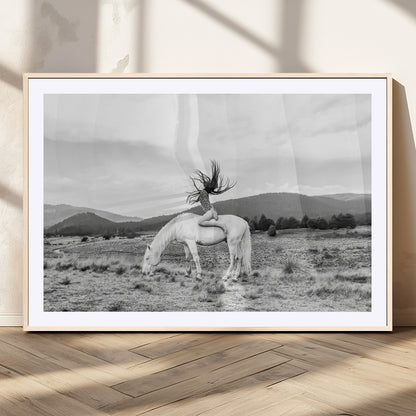 Black and white photo of a woman on a white horse in moody tones, ideal for Western Boho or modern rustic-style home decor.