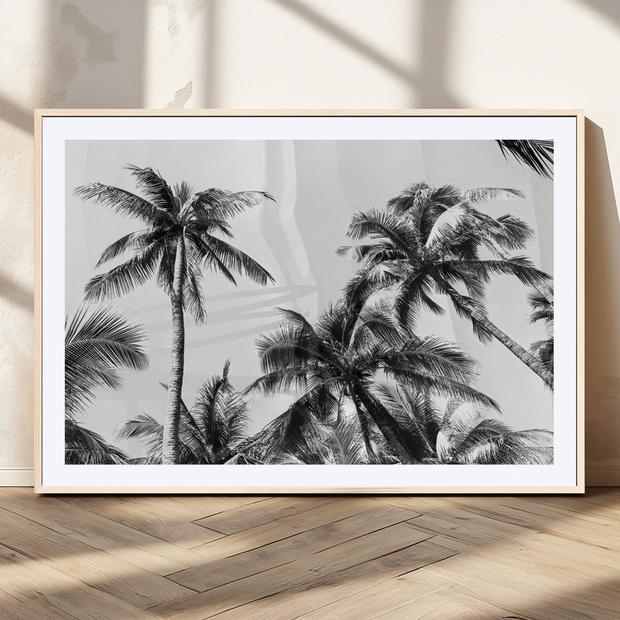 Black and white canvas of tall palm trees in moody tones, perfect for modern tropical minimalist or coastal-style home decor.