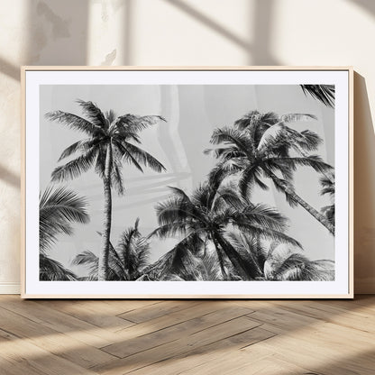 Black and white canvas of tall palm trees in moody tones, perfect for modern tropical minimalist or coastal-style home decor.