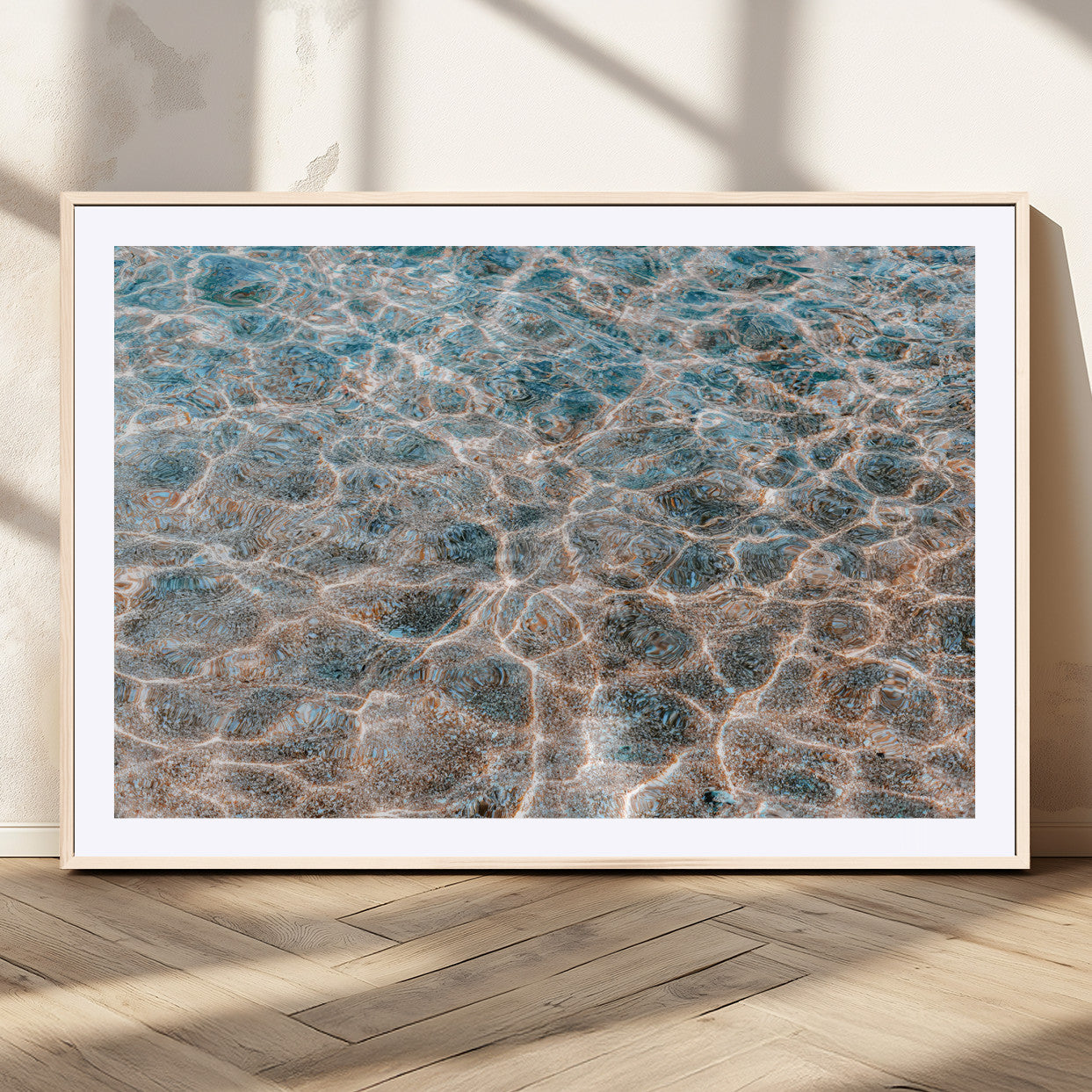 Close-up of sunlit ocean ripples with aqua blue and golden tones, ideal for modern coastal or minimalist home decor.