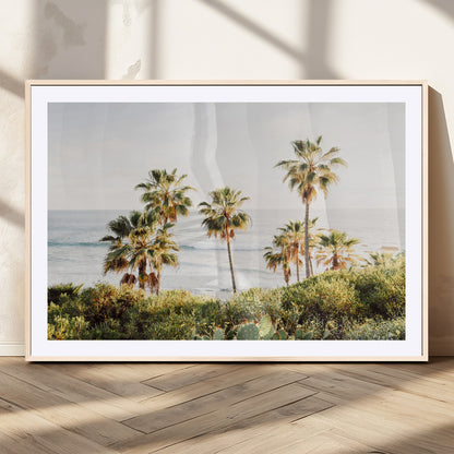 Framed print of sunlit palm trees on the California coast with warm tones, perfect for coastal minimalist or beach-style home decor.