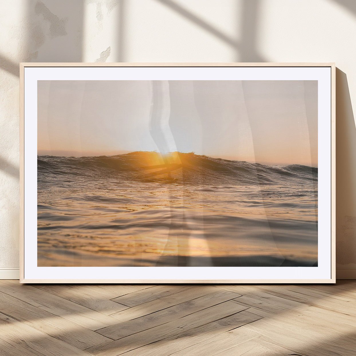 Ocean waves glowing under a warm golden sunset, reflecting soft light and calm movement, perfect for warm minimalist coastal interiors.