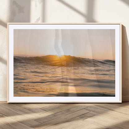 Ocean waves glowing under a warm golden sunset, reflecting soft light and calm movement, perfect for warm minimalist coastal interiors.