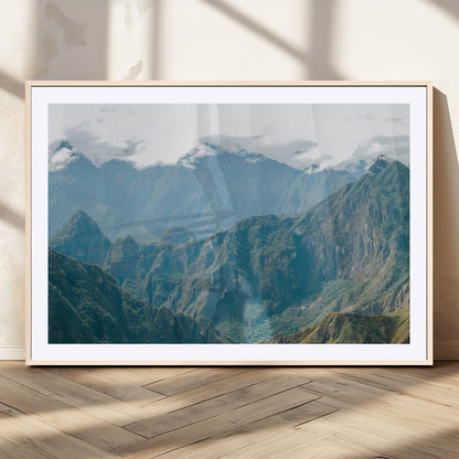 A misty mountain landscape with cloud-covered Andean peaks and lush green valleys, creating a dramatic and serene view, perfect for rustic or nature-inspired home decor.