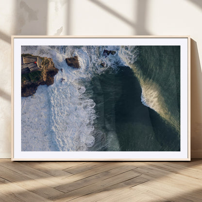 Canvas showing an aerial view of crashing waves along the Nazaré coastline, perfect for dramatic coastal or ocean-themed home decor.