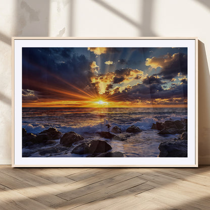 An explosive sunset over the ocean with dramatic clouds and rays of sunlight reflecting off the water, creating a vibrant and captivating view.